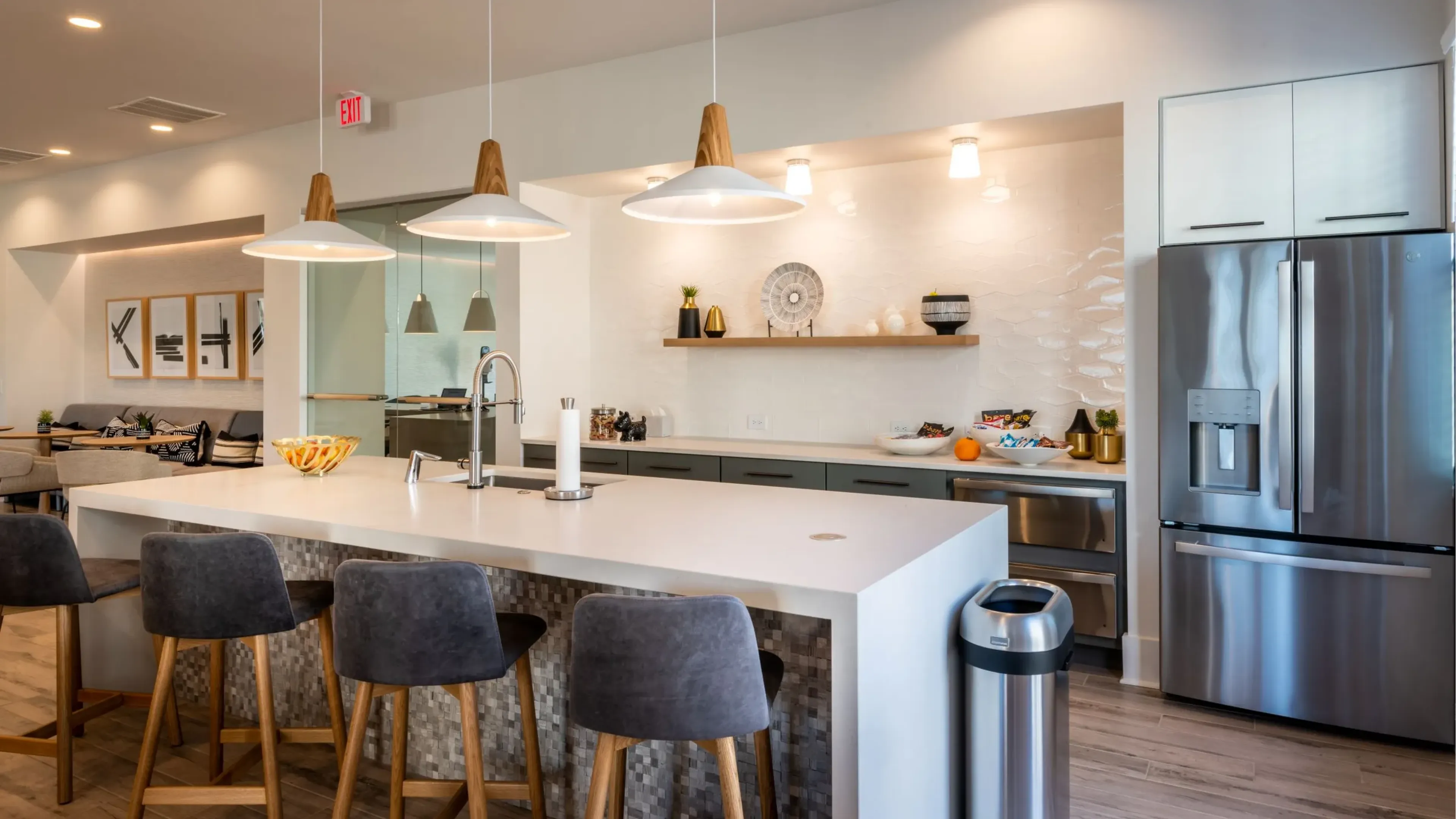 Hawthorne at Parkside beautiful outdoor courtyard amenity with a grill area and firepit, overhanging lights drape across the courtyard