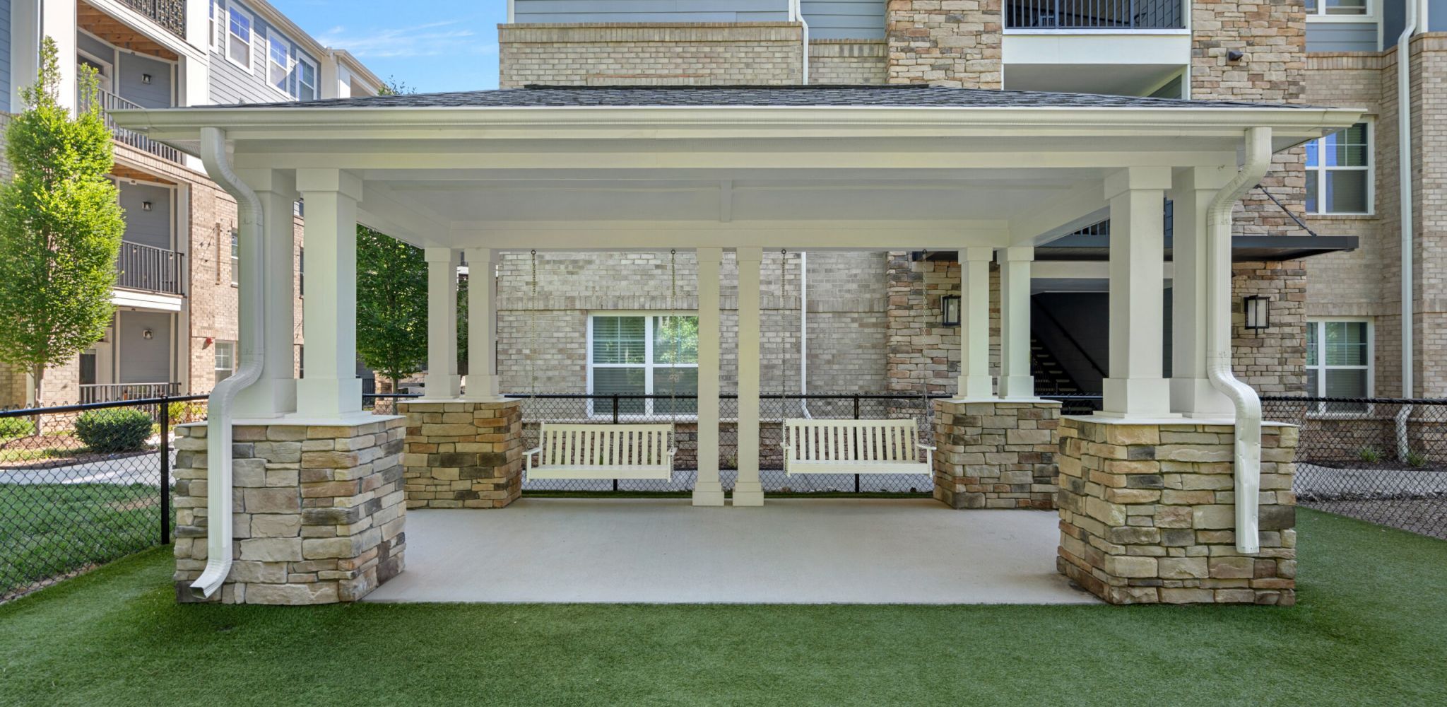 Hawthorne at Parkside pretty outdoor courtyard area with draping lights and a fire pit